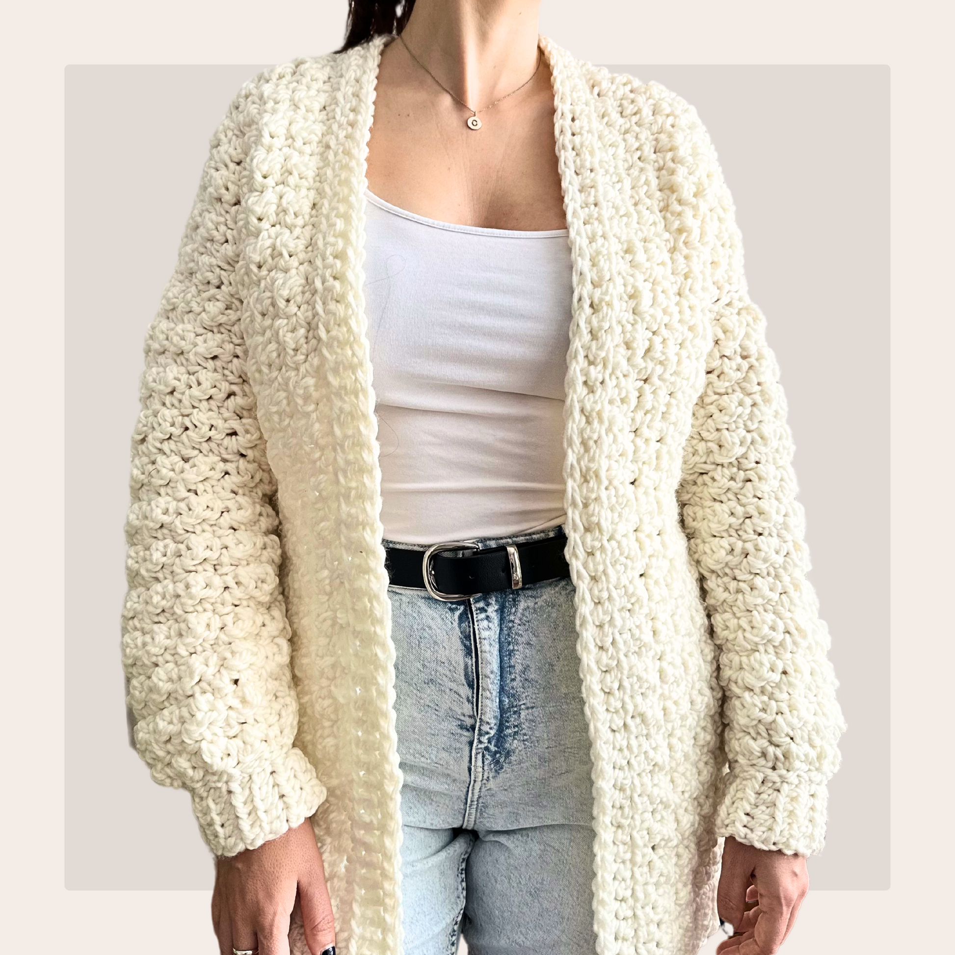 front shot of lemon peel cardigan worn over   a white vest and blue jeans.